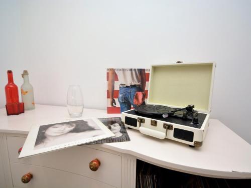 a white table with a radio on top of it at 3 bed in Appledore 63065 in Appledore