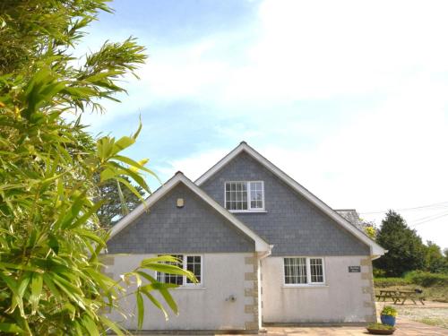 a white house with a gray roof at 5 Bed in Newquay 46489 in Truro