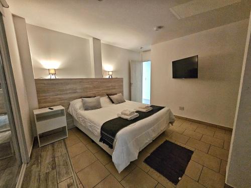 Postel nebo postele na pokoji v ubytování infinity sky deluxe