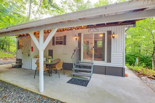 a patio with a table and a house at Hike, Swim, Ski and More Pet-Friendly Newland Home! in Newland