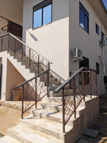 a set of stairs outside of a house at Alcyone Residence - Ocean View Villa in Muyuni