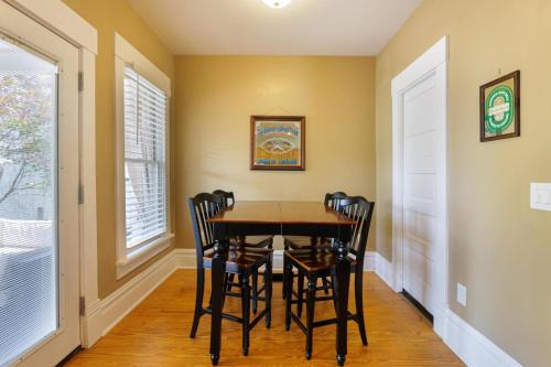 a dining room with a table and chairs at Home with Garage, Hot Tub, near OSU & Short North in Columbus