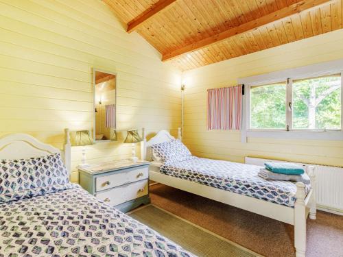 En eller flere senge i et værelse på 2 Bed in Clovelly BITFL