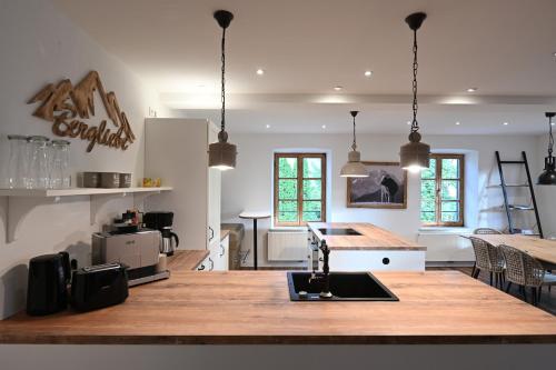 a kitchen with a large wooden table in a room at Charmante Altbauwohnung mit Flair in Polling in Polling