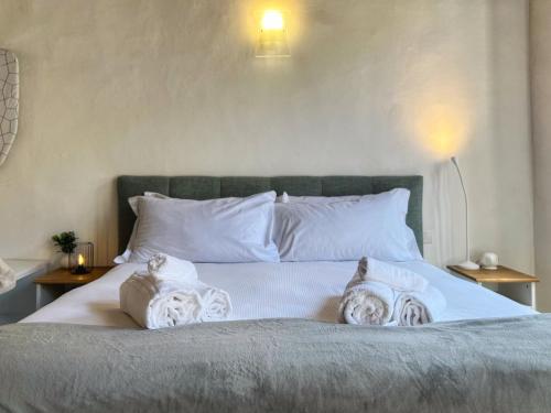 a bed with two pillows on top of it at Tuscany Old Town in Arezzo