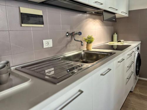 a kitchen with a sink and a stove at Tuscany Old Town in Arezzo