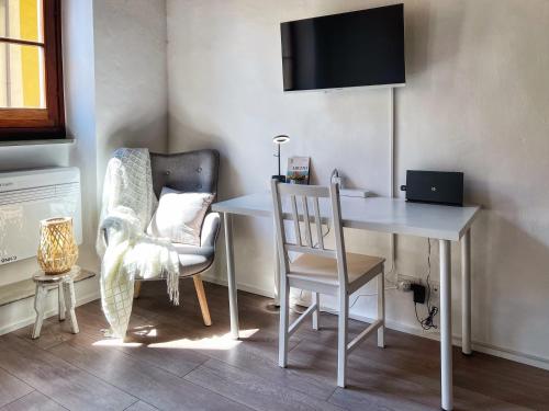 a room with a desk and a chair and a tv at Tuscany Old Town in Arezzo