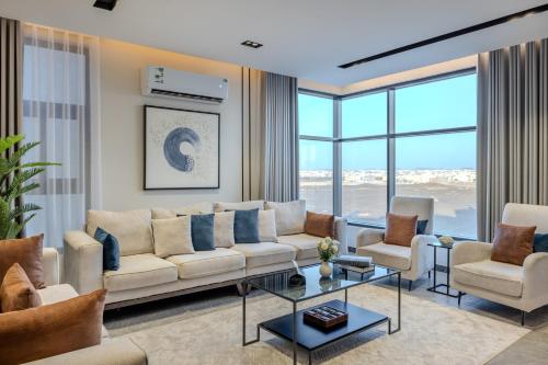 a living room with a couch and chairs and a table at Super Luxury SweetHome in Medina