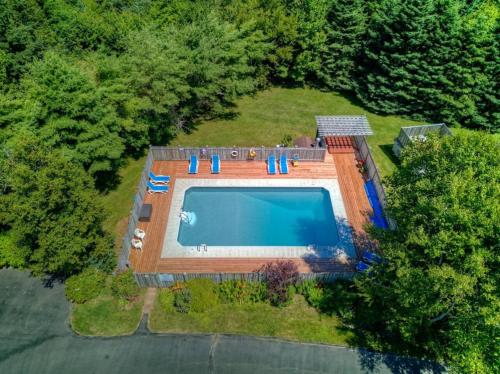 an overhead view of a swimming pool in a yard at The Laurel Leaf at Annes Windy Poplars in Cavendish