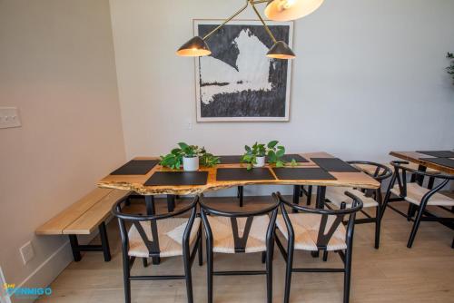 a dining room with a wooden table and chairs at Gathering Place Hot Tub Game rooms in Orem