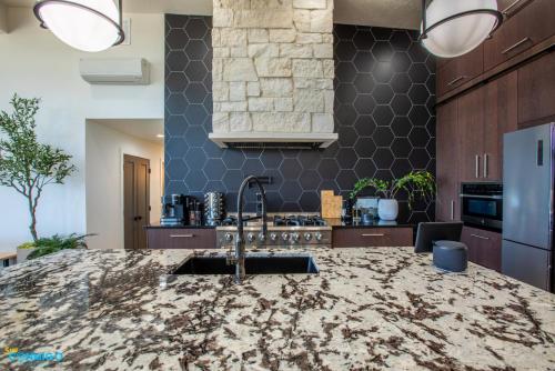 a kitchen with a sink and a counter top at Gathering Place Hot Tub Game rooms in Orem