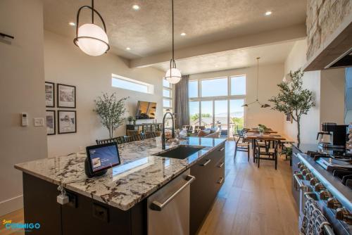 a kitchen with a large island with a counter top at Gathering Place Hot Tub Game rooms in Orem