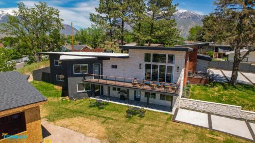 an aerial view of a house with a yard at Gathering Place Hot Tub Game rooms in Orem
