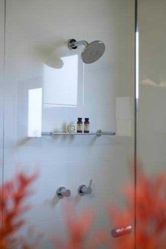 a bathroom with a shower with a glass door at Hartzell One Seven in Wilyabrup