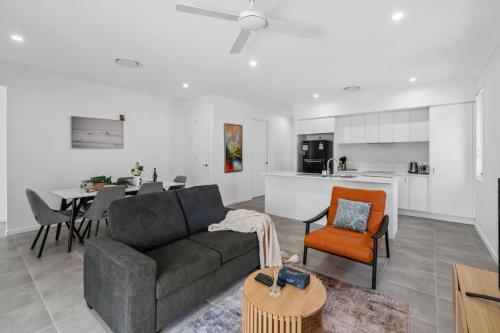 a living room with a couch and a table at Spacious 4BR Home Great Area close to everything in Ripley