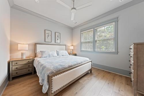 a bedroom with a bed and a window at Stunning New Home with Private Pool in Seabrook Island