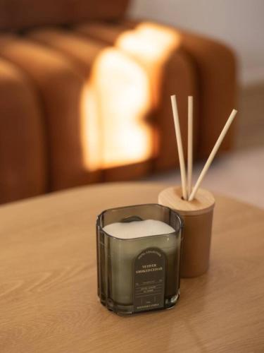 a candle sitting on top of a table at Spacious Home 4BR Retreat with Pool in Parkinson in Browns Plains