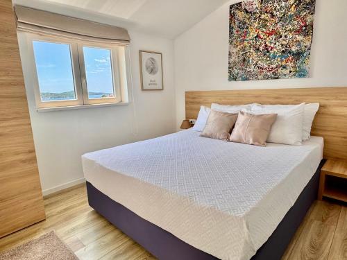 Postel nebo postele na pokoji v ubytování Golden Apartments