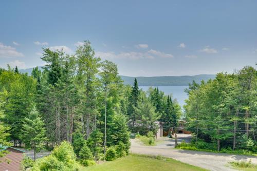 an aerial view of a road with trees and a lake at Rustic 3-Story Pittsburg Cabin with Lake and Mtn Views in Pittsburg