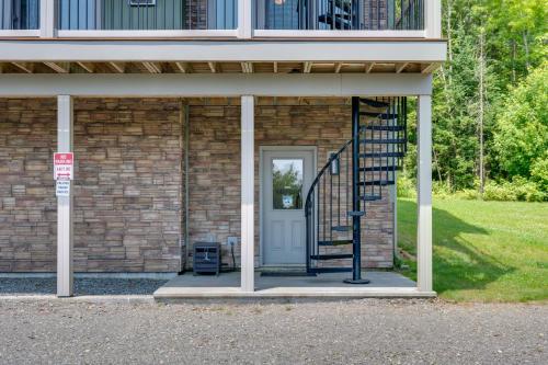 a house with a staircase leading to a door at Rustic 3-Story Pittsburg Cabin with Lake and Mtn Views in Pittsburg