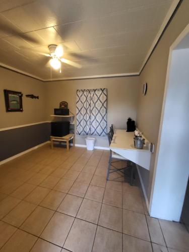 a living room with a table and a couch at Hill Country Lodge and Mini Storages in Buchanan Dam