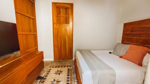 Postel nebo postele na pokoji v ubytování Hotel Unknown