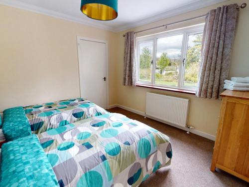 a bedroom with a bed and a window at 3 bed property in Onich CA159 in Onich