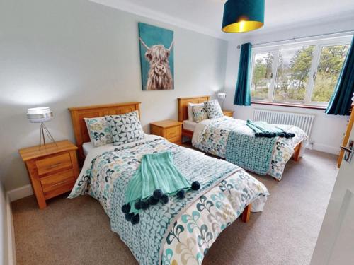 a bedroom with two beds and a window at 3 bed property in Onich CA159 in Onich