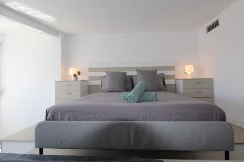 En eller flere senge i et værelse på The Blue Corner Penthouse