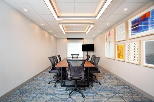 a conference room with a table and chairs at Holiday Inn Express & Suites Florida City-Gateway To Keys by IHG in Florida City