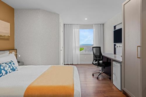 Ένα ή περισσότερα κρεβάτια σε δωμάτιο στο Days Inn by Wyndham Riviere-Du-Loup