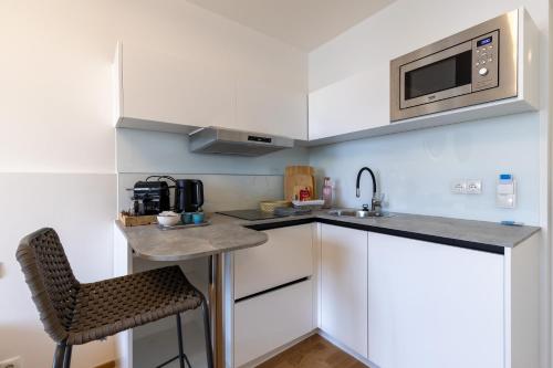 2BR Getaway w Balcony & Fast WiFi, Near Tram