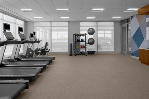a gym with rows of treadmills and machines at SpringHill Suites by Marriott Grand Island in Grand Island