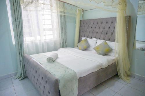 Postel nebo postele na pokoji v ubytování SpringStone executive apartment A18