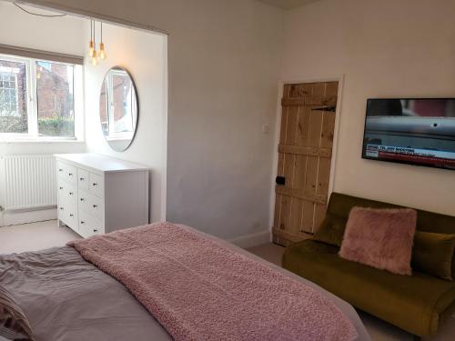 Postel nebo postele na pokoji v ubytování Ellerslie Cottage