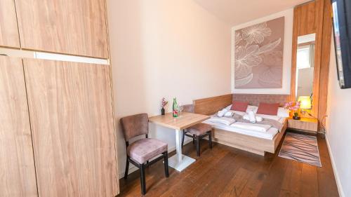 Ένα ή περισσότερα κρεβάτια σε δωμάτιο στο Christiano Apartments Hauptbahnhof | contactless check-in