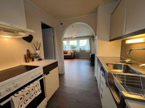 a kitchen with a sink and a counter top at Fonnagata in Åndalsnes