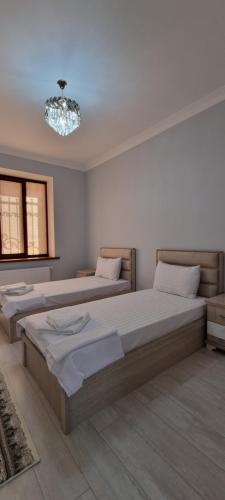 Postel nebo postele na pokoji v ubytování Asia Luxe Apartment