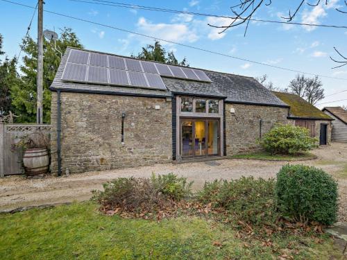 an old stone house with solar panels on it at 2 Bed in Coleford 78181 in Symonds Yat