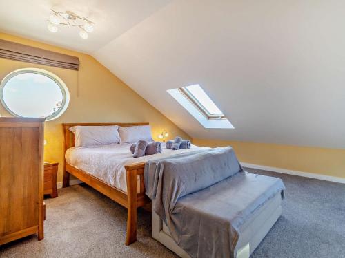 a bedroom with a bed and a skylight at 2 Bed in Cromer 29556 in Cromer