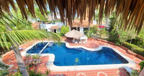 an overhead view of a swimming pool in a resort at Casa Rosa Paradise in Puerto Escondido