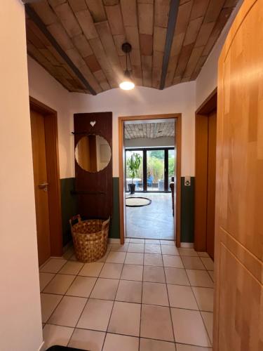 a hallway with a door leading to a yard at Wohnen im ehemaligen Kuhstall Stiehler Farm in Treia