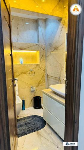 a bathroom with a sink and a toilet at Stylish & Trendy in Cairo