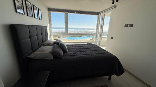 Ένα ή περισσότερα κρεβάτια σε δωμάτιο στο Laguna, playa arrecife 414