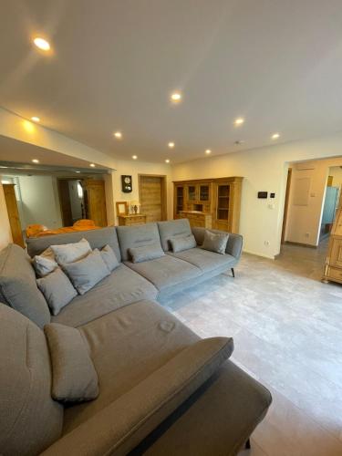 a large living room with a couch and a table at Ferienwohnung Am Sand in Wernberg-Köblitz