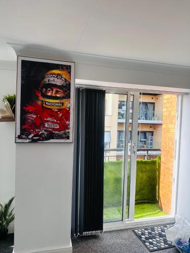 a picture of a man on a poster on a wall at Enjoy city living in this one-bedroom flat, complete with a balcony and secure parking in Birmingham city center in Birmingham