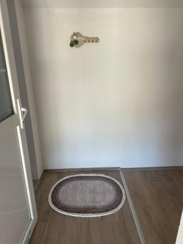 a room with a round rug on the floor at Daily corner in Bujanovac