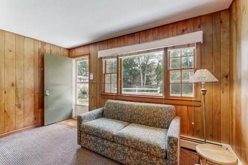 a living room with a couch and a window at King Birch Lake Home, Unit 6 in Alton