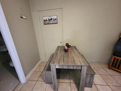 a wooden table in the corner of a room at Hill Country Lodge and Mini Storages in Buchanan Dam