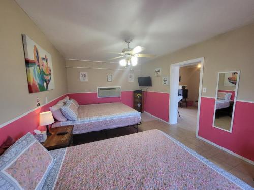 a living room with a bed and a couch at Hill Country Lodge and Mini Storages in Buchanan Dam